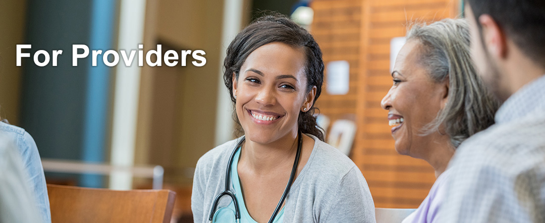 Smiling healthcare professional with stethoscope engages with an older woman and man. Text reads 